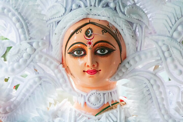 Kolkata, West Bengal, India - 7th October 2018 : Clay idol face of Goddess Durga, with white dress...
