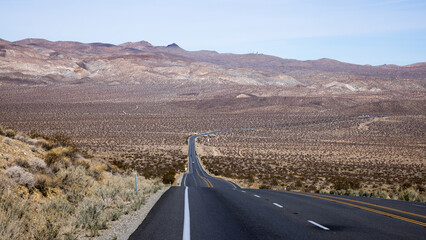Desert road toward the mountains