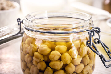 chickpeas resting in compote to be cooked to make aquafaba, vegan ingredient being prepared in the kitchen