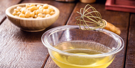 aquafaba in a kitchen pot, compote with organic chickpea legume water, used as a vegan alternative