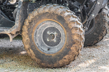 Fototapeta na wymiar Dirty wheels and tires from quads in jungle Mexico.