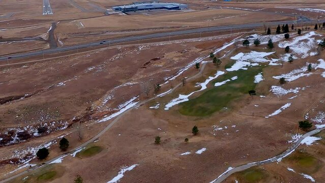 Looking down as an airplane approaches the runway of the Rocky Mountain Metropolitan airport to land