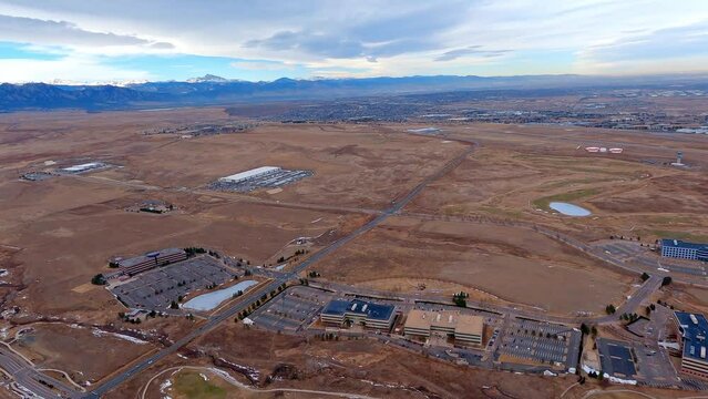 View of Rocky Mountain Metropolitan Airport from an airplane flying the downwind leg with Longs Peak in the distance