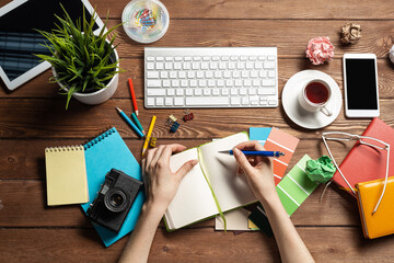 Close up woman hand writing in notebook
