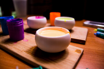 palette with blue, red, pink paint on a wooden base