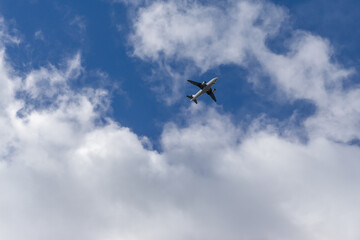 Aircraft in the sky passing through clouds