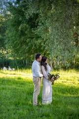 Elegant bride and groom posing together outdoors on a wedding day