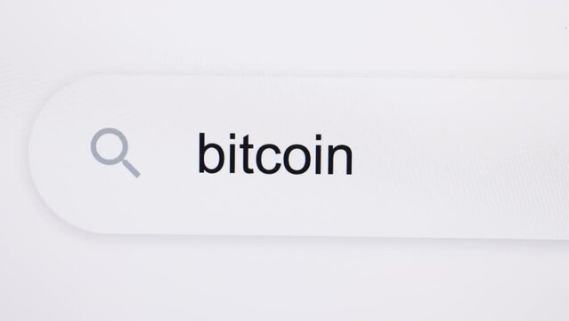 Bitcoin - Internet browser search bar typing destination text with camera movement. Typing the word Bitcoin in the browser on a pixelated computer screen.