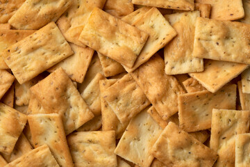 Fresh traditional Italian Scrocchi ,  rosemary and sea salt crackers full frame close up as background