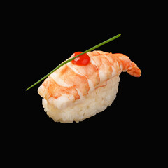 japanese nigiri sushi with tiger shrimp, sriracha sauce, chives. isolated on black background