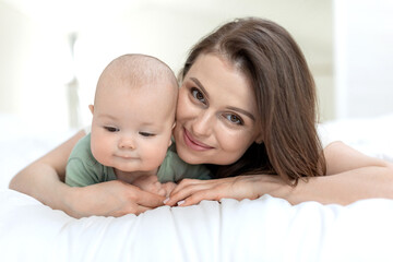 A woman with a small child. Mom with a baby. High quality photo