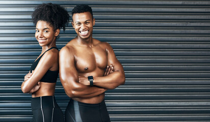 Make today count towards a better tomorrow. Portrait of a sporty young couple standing together against a grey background.