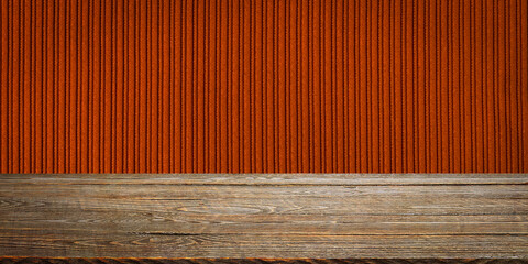 The background is blank wooden boards and a textured striped wall with gradient lighting and vignetting.