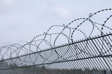 Fence metal with barbed wire
