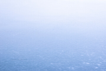 Fototapeta na wymiar Natural texture of ice, frozen lake as background.