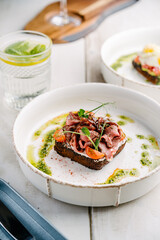 Smorrebrod, Danish open sandwich with roast beef, sweet onion and cherry tomato