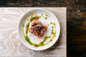 Smorrebrod, Danish open sandwich with roast beef, sweet onion and cherry tomato. top view