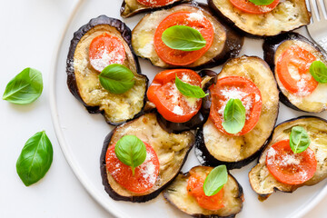 Baked eggplant with tomato, cheese and basil