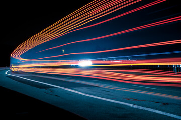 Night road lights. Lights of moving cars at night. long exposure red, blue, green