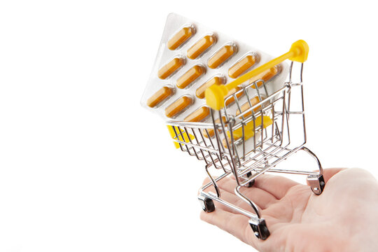 image of trolley pills hand white background 