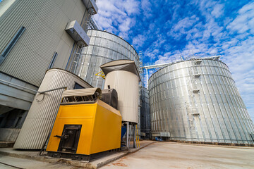 Obraz premium Modern agricultural factory architecture. Industrial factory metal construction.