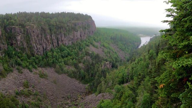 Ouimet Canyon Provincial Park with view of dramatic diabase rock cliffs and  Gulch Lake in rain