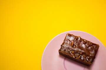 Slice of mousse cake on a yellow background