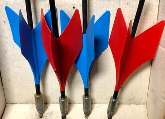Close-up of old vintage set of red and blue lawn darts