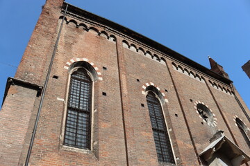 Verona, Italy-March 19, 2022: Beautifull old buildings of Verona. Typical architecture of the medieval period. Aerial view to the city with blue sky in the background.