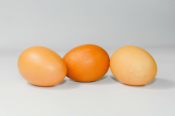 eggs isolated on a cutting board white background ,several eggs.