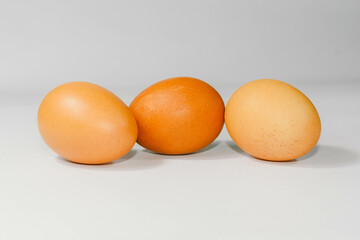 eggs isolated on a cutting board white background ,several eggs.