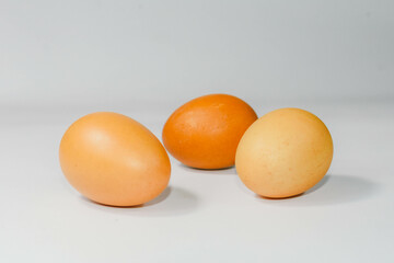 eggs isolated on a cutting board white background ,several eggs.