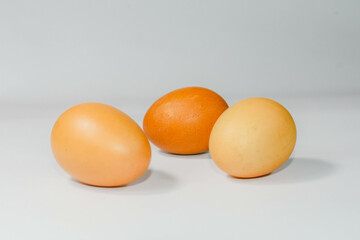 eggs isolated on a cutting board white background ,several eggs.
