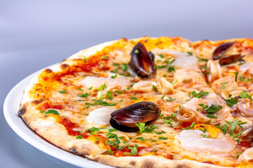 Pizza with seafood, mussels, shrimp, squid