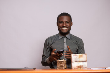nigerian man with plenty money and using his phone