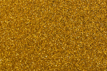 shiny background of golden sand grains, Metallic shimmers paper