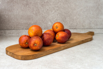red bloody oranges on a cutting board. close-up.
