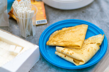 Pancakes in a plate at a picnic. Rest at nature.