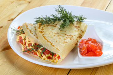 Pancake with salmon fiilet and cheese