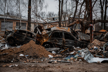 Fototapeta premium Burnt car after being hit by a rocket in Kyiv