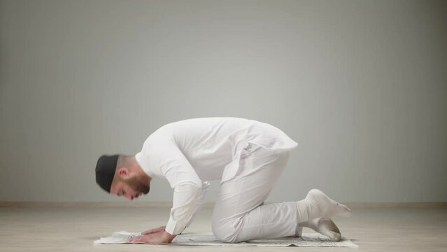 Muslim man praying close-up, islamic religion. Religious holiday Ramadan, holy month. Worship, person making traditional prayer to God, namaz. 