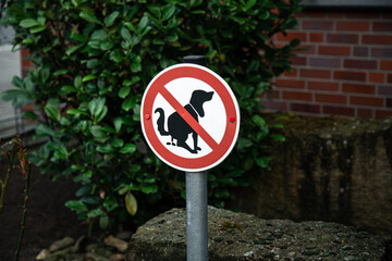 A sign no dog poop . Concept cleaning up dog droppings.
