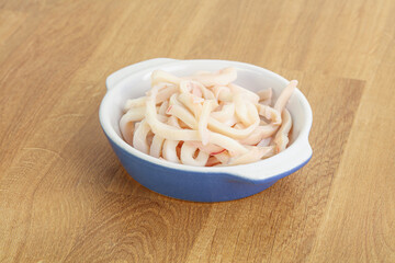 Marinated squid strips in the bowl