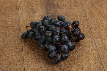 Purple grape branch over background