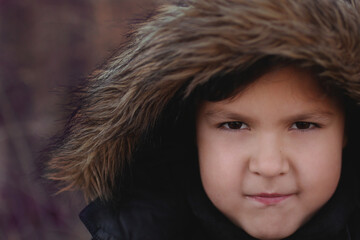 child in fur hat