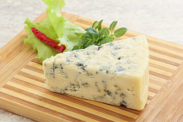 Blue cheese piece over board