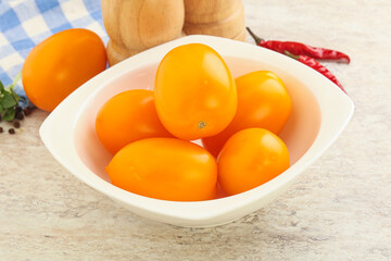 Sweet ripe yellow tomato in the bowl
