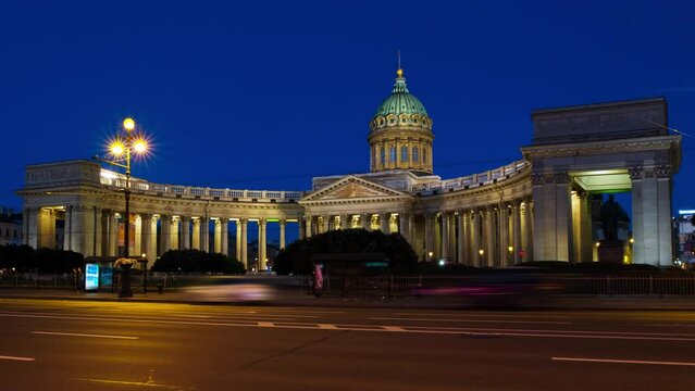 St Petersburg, Russia. Illuminated Cathedral of Our Lady of Kazan, Russian Orthodox Church in Saint Petersburg, Russia at night with car traffic trail lights at the forefront. Time-lapse, zoom in