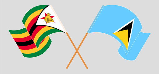 Crossed and waving flags of Zimbabwe and Saint Lucia