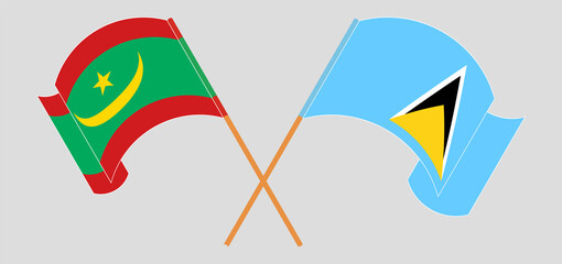 Crossed and waving flags of Mauritania and Saint Lucia